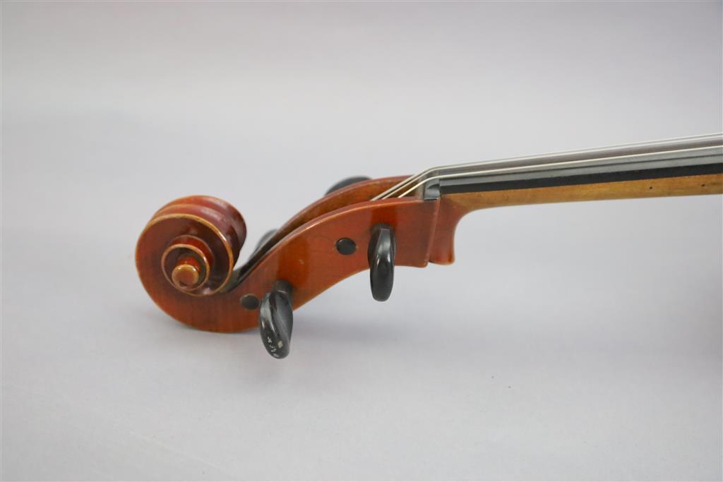 A late 19th/early 20th century German cello, labelled Schutz HD junior Marke, length of back 77cm